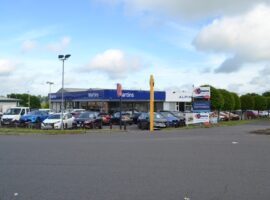 RARE OPPORTUNITY - CAR DEALERSHIP SITE AND PREMISES - Approximately 18,000 sq ft, 1.25 acres - LEASEHOLD TO ASSIGN